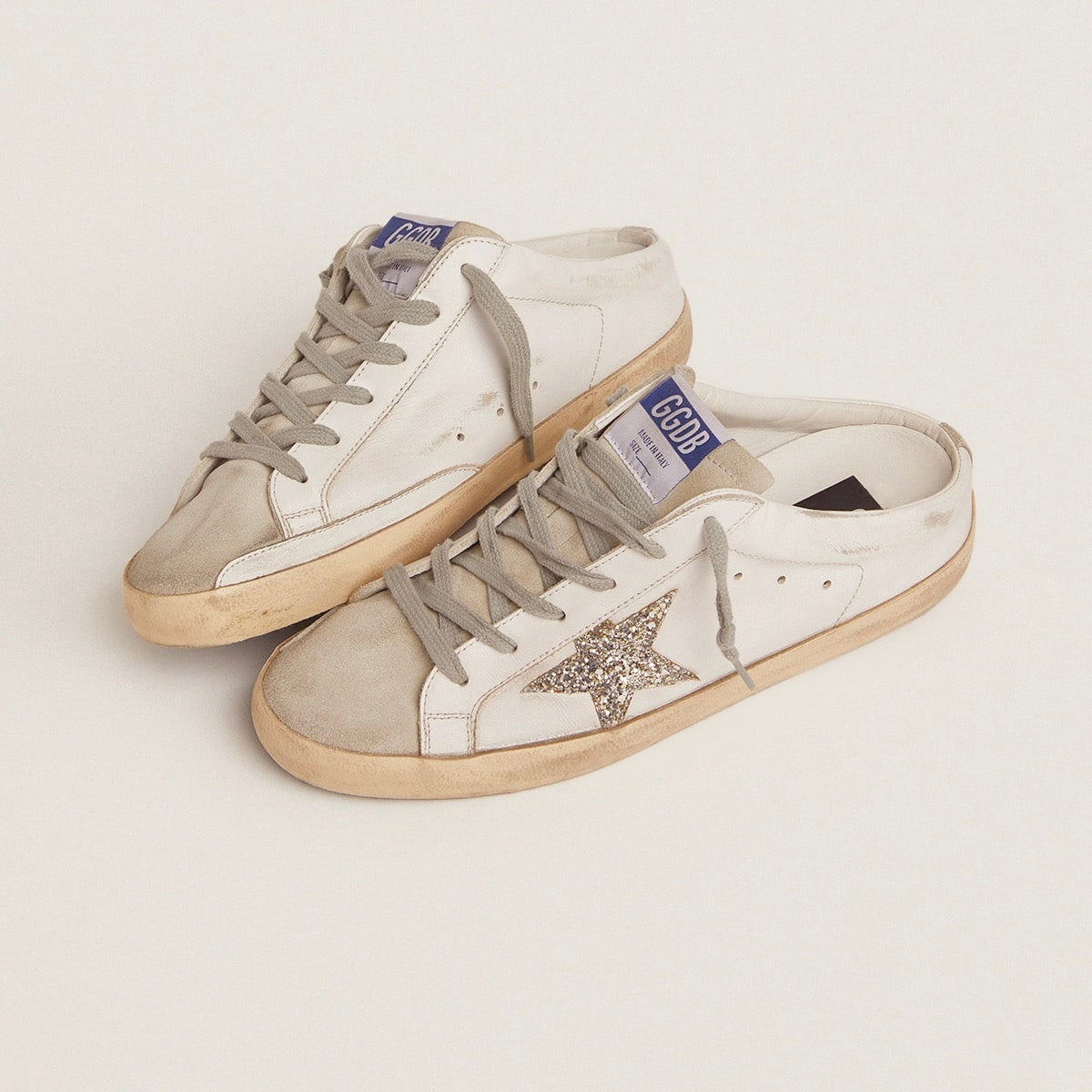 Golden Goose Super-Star Sabot with a platinum glitter star and suede tongue(Women's)
